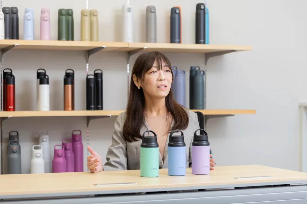 Takada talking about how bottle colors are decided